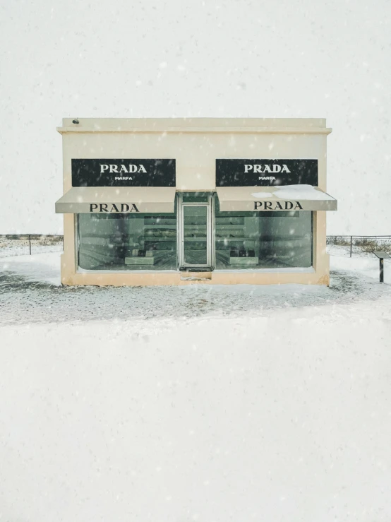 a storefront with snow falling on it