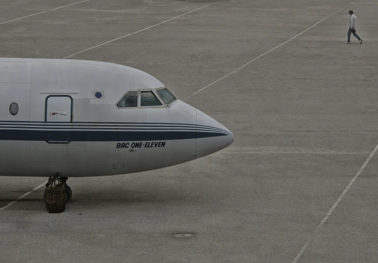 a person walking toward the door of a passenger jet