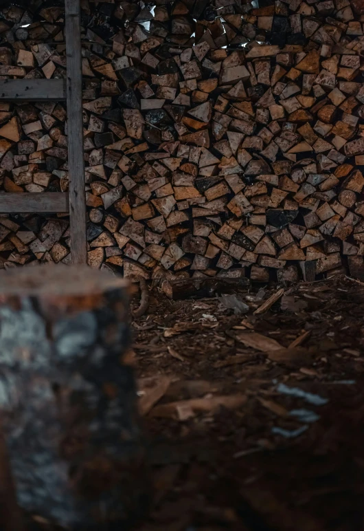 a chair is placed next to a stack of wood