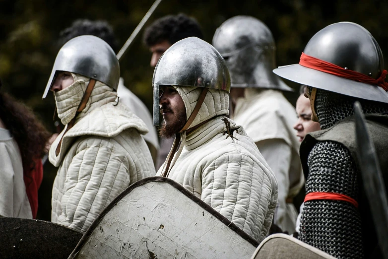 a group of people wearing helmets and coats