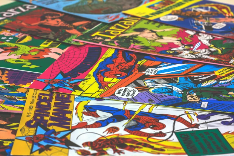 a collection of comics is shown on the table