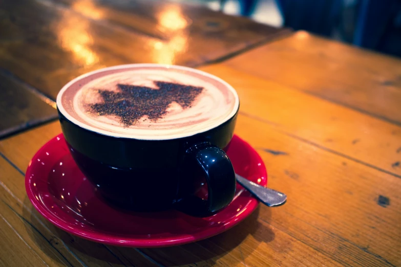 there is a cup of cappuccino on a saucer