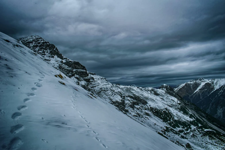 a man skiing on top of a snow covered slope