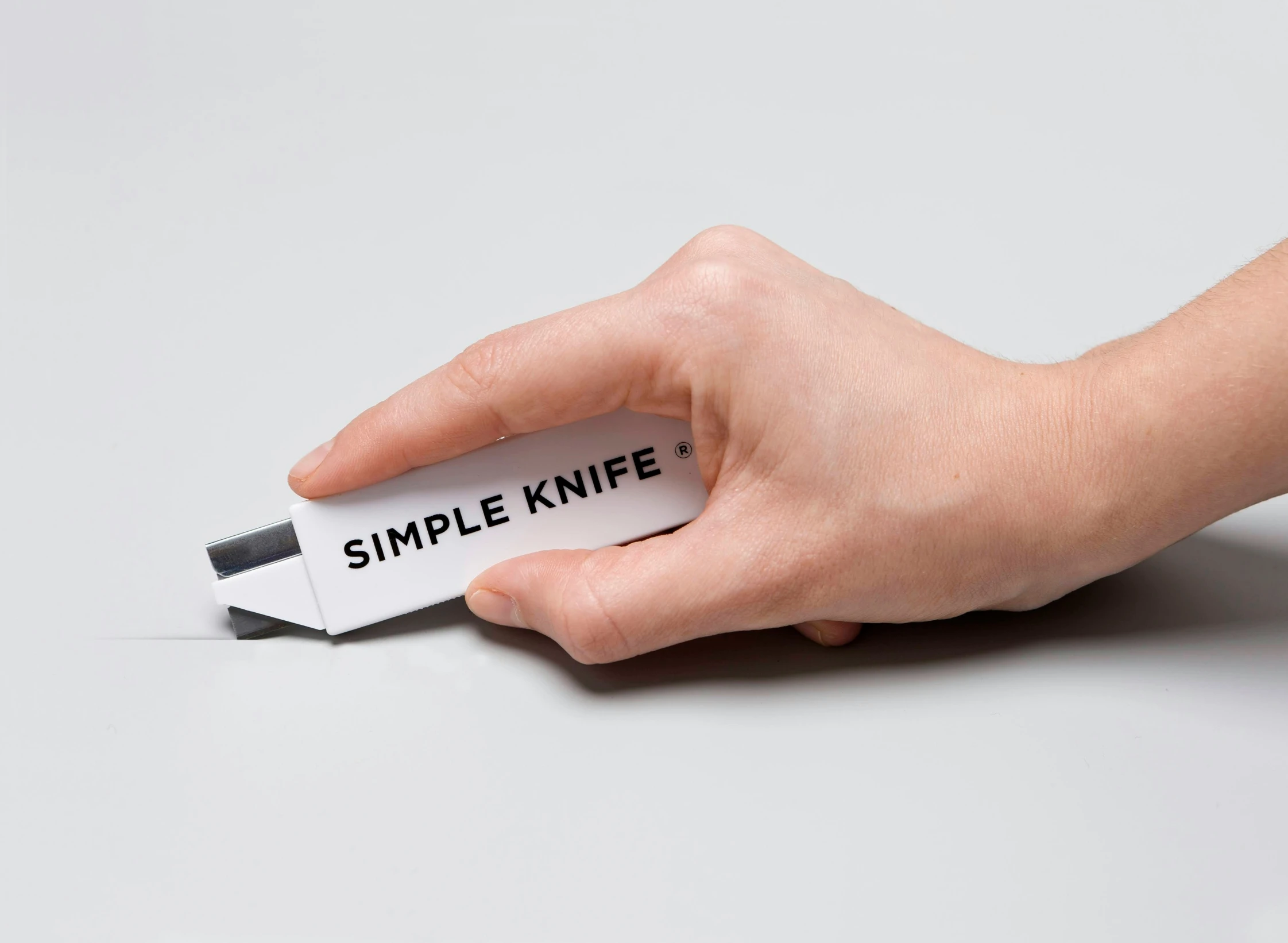 a white and black paper that says simple knife