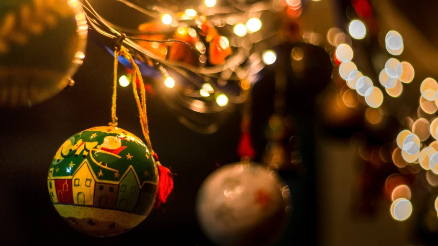 a ornament hanging on the end of a christmas tree