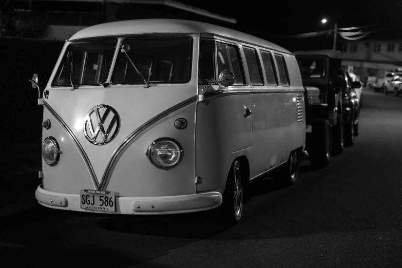 old bus parked on a street with the word volkswagen on the side of it