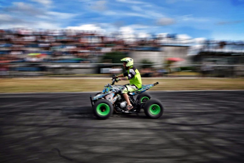 an individual riding an atv in a competition