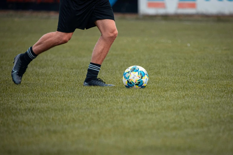 a man is playing soccer on a field