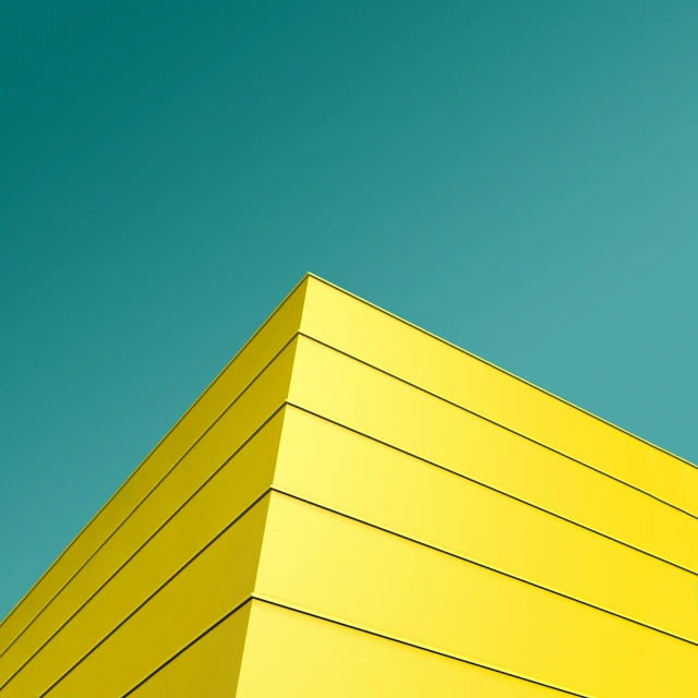 the yellow structure is against a blue sky