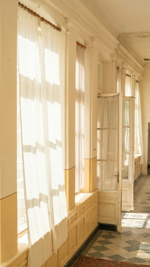 a po of the hallway in a house with a lot of sunlight