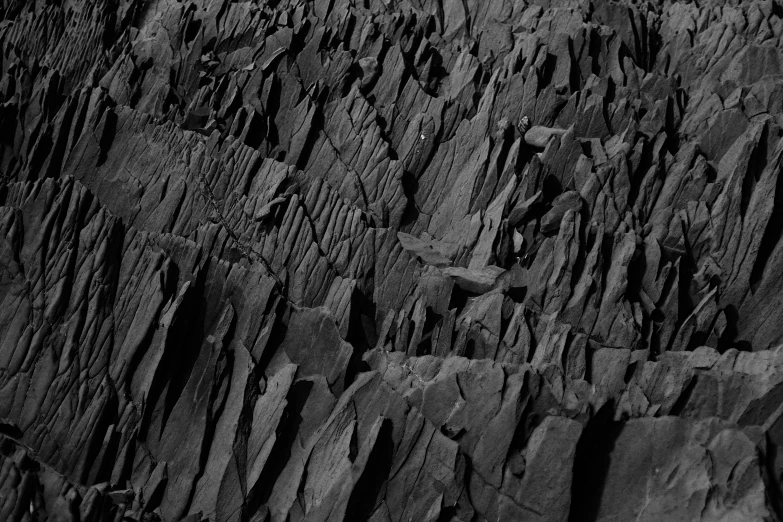 black and white pograph of rocks that are stacked together