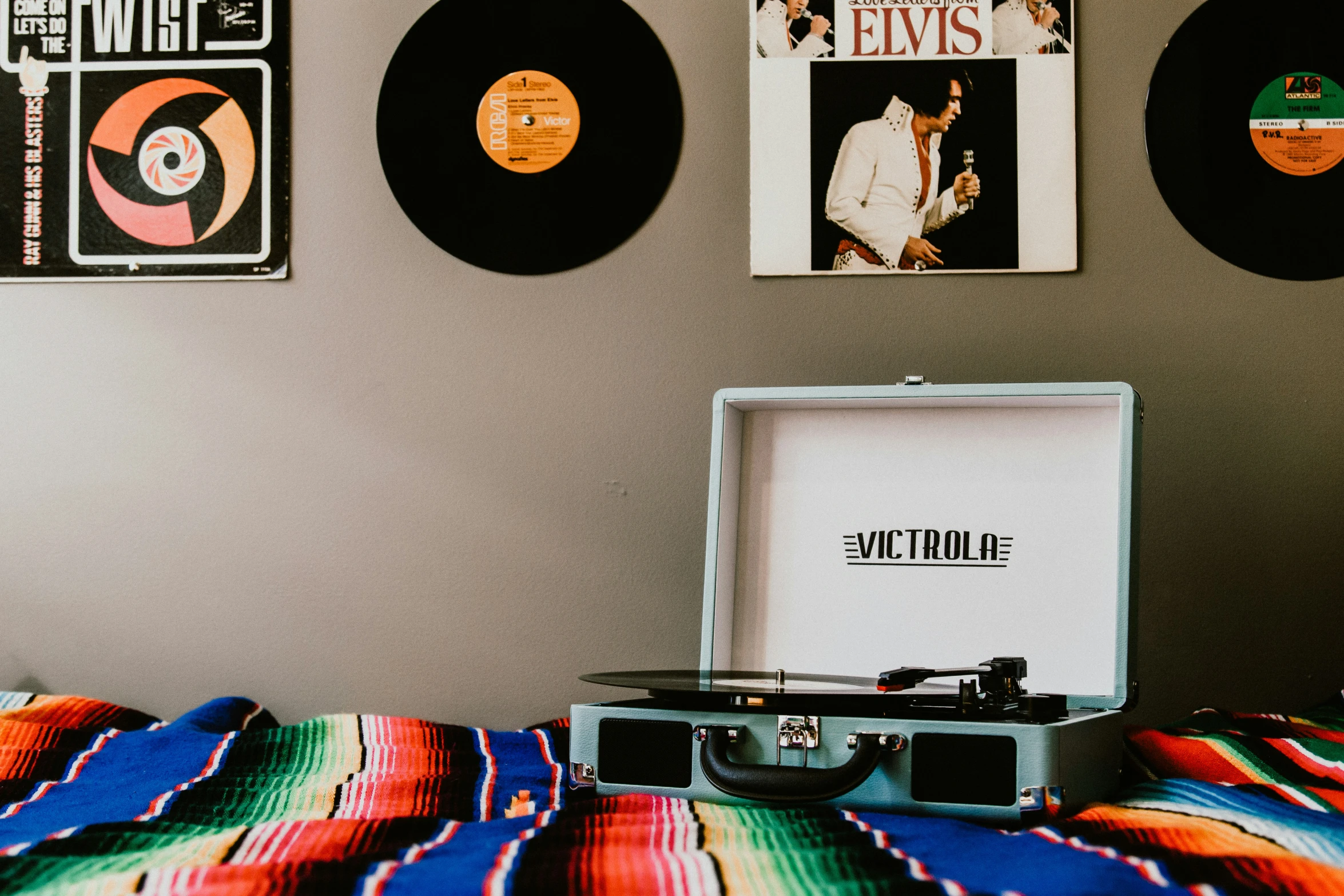 vinyl records are stacked up against the wall