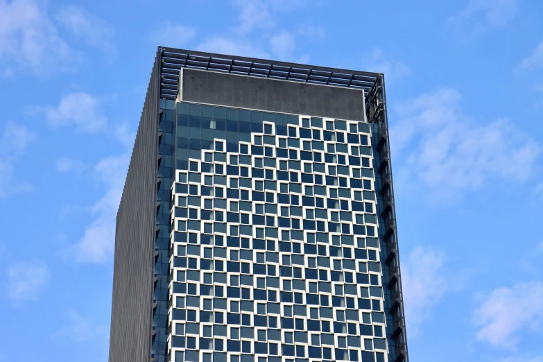 a big tall building with several different types of windows