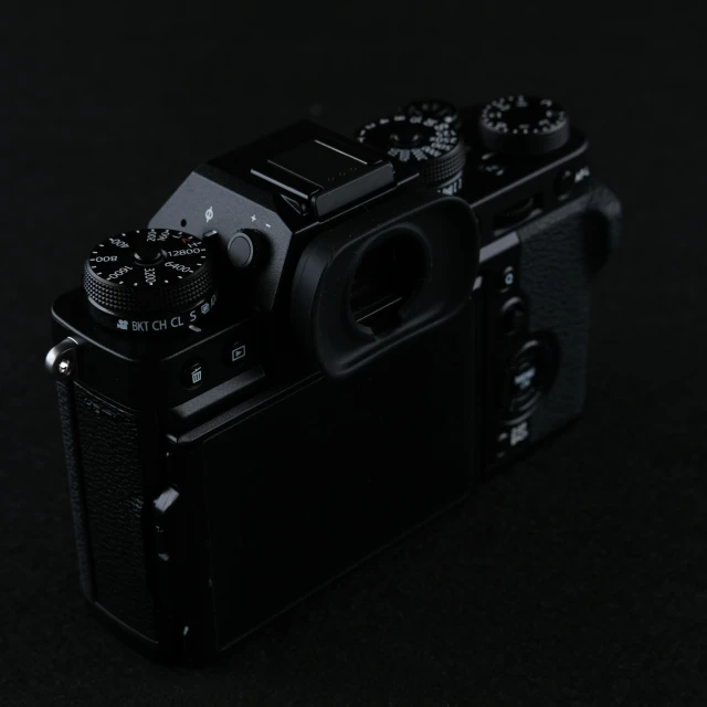 a black camera with three different pictures on it