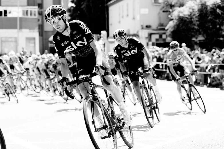 black and white po of bicycles going up a hill