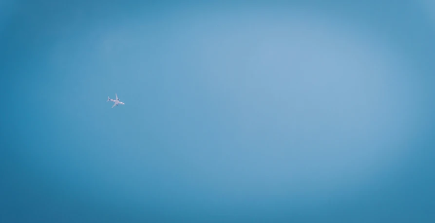 an airplane flying through the sky, and its tail is out