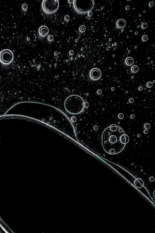 an iphone is shown with bubbles floating