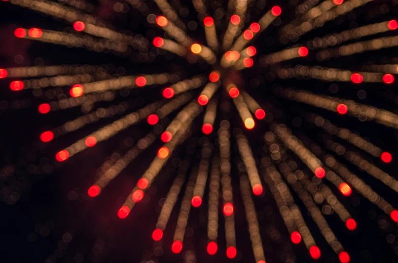 red and white lights glow brightly as the ferris wheel is lit