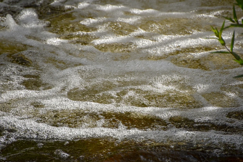 the water is flowing in a lake and it looks like waves