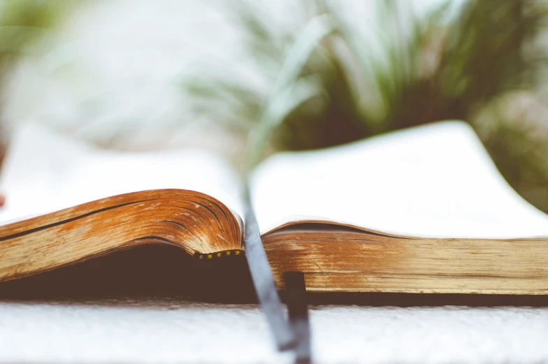 an open book sitting on top of a table