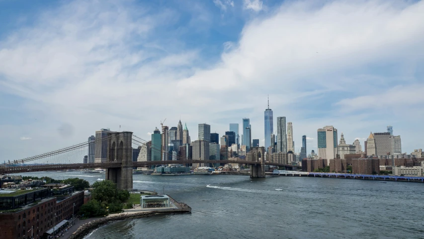 a view of a bridge and some very tall buildings