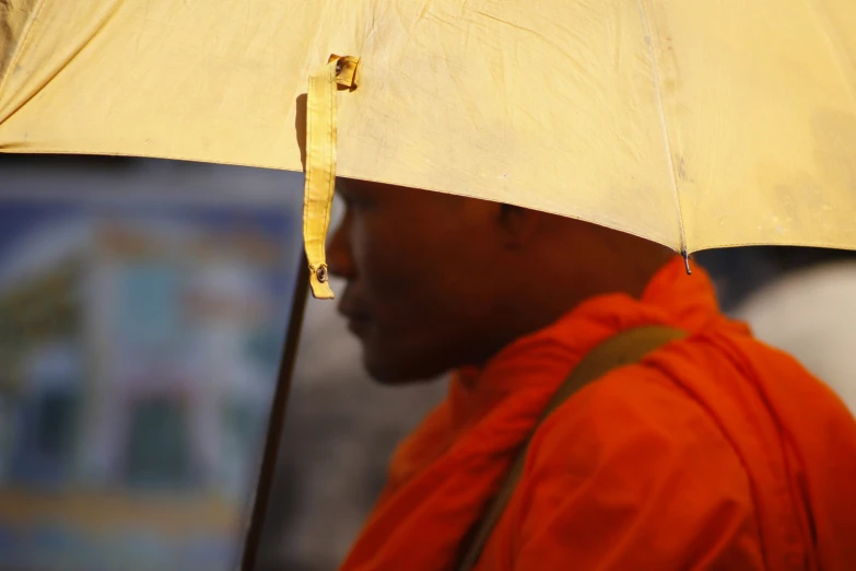 a close up of a man with an umbrella