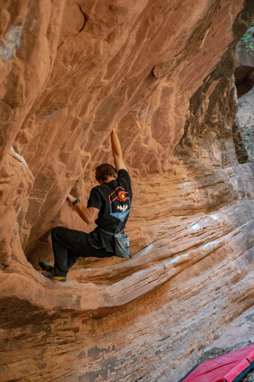 a person that is climbing on some rocks