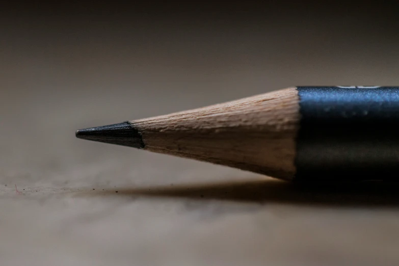 pencil standing upright in the middle of a po