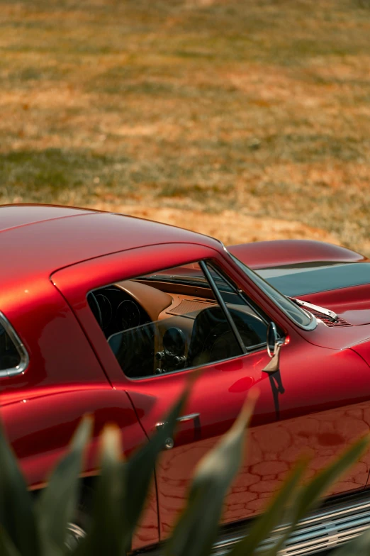 red old classic car with a large metal wheel hub