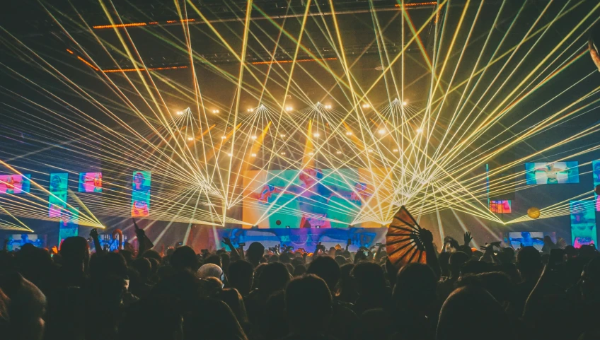 an audience watches fireworks on a stage