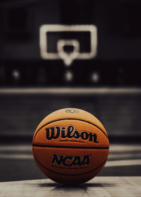 the basketball is on the floor near a basket