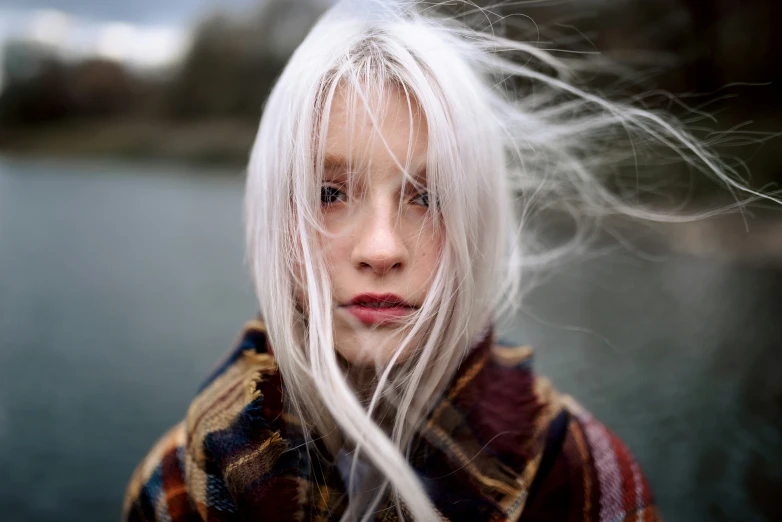 a blonde haired woman with long white hair