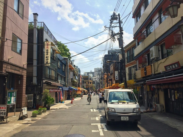 a van is parked on the side of a city street