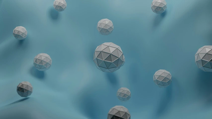 many large balls are in the middle of some water