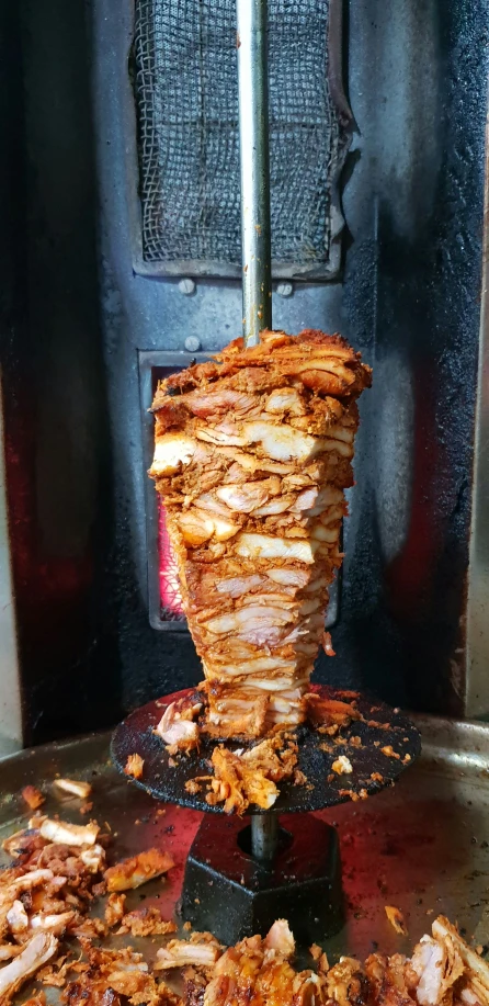 a close up of a person  food on a grill