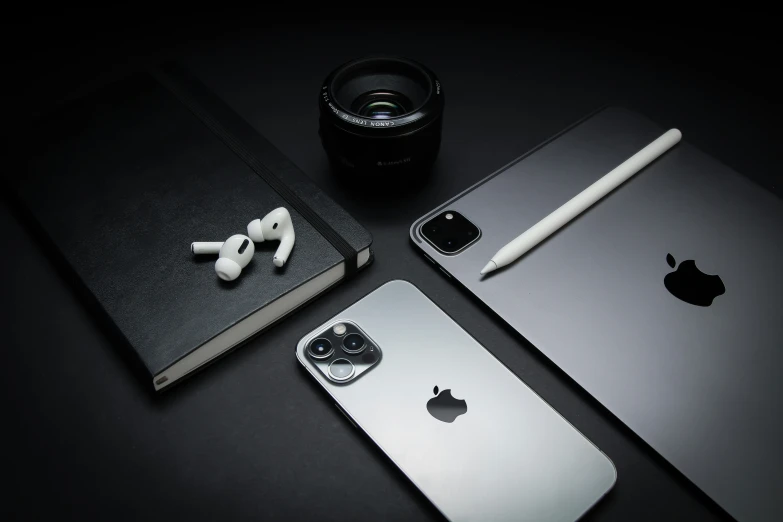 a camera and cell phone with an apple pen