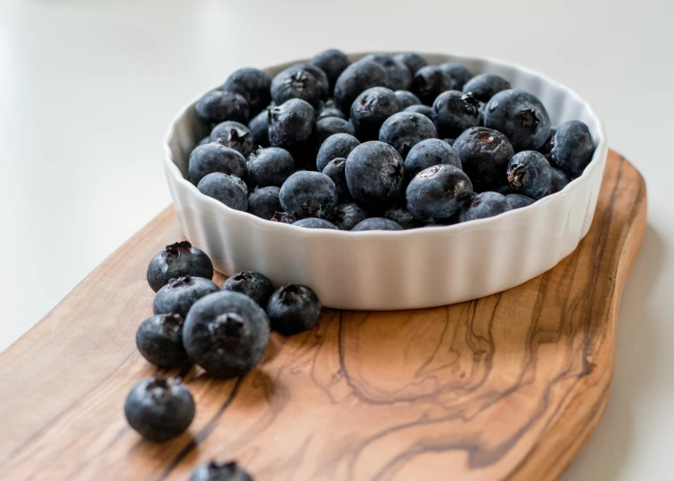blueberries sit in the bottom of the dish, beside a spoon