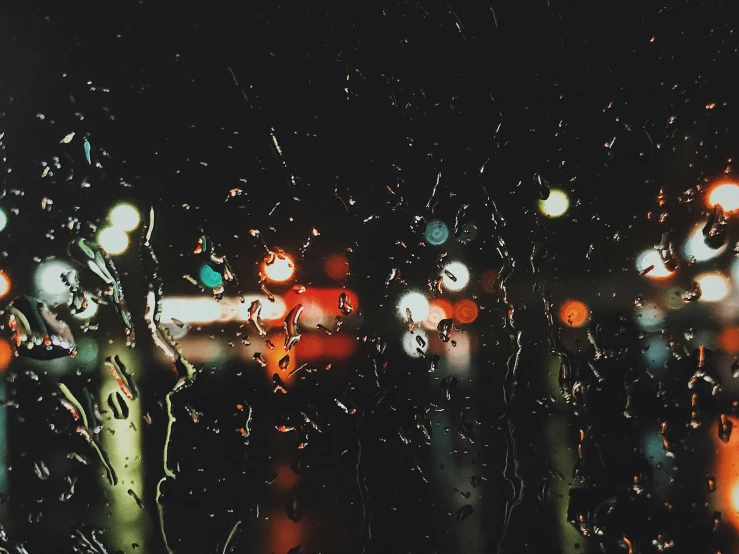 a rainy view of buildings through a window