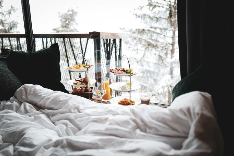 a window view of some drinks and food