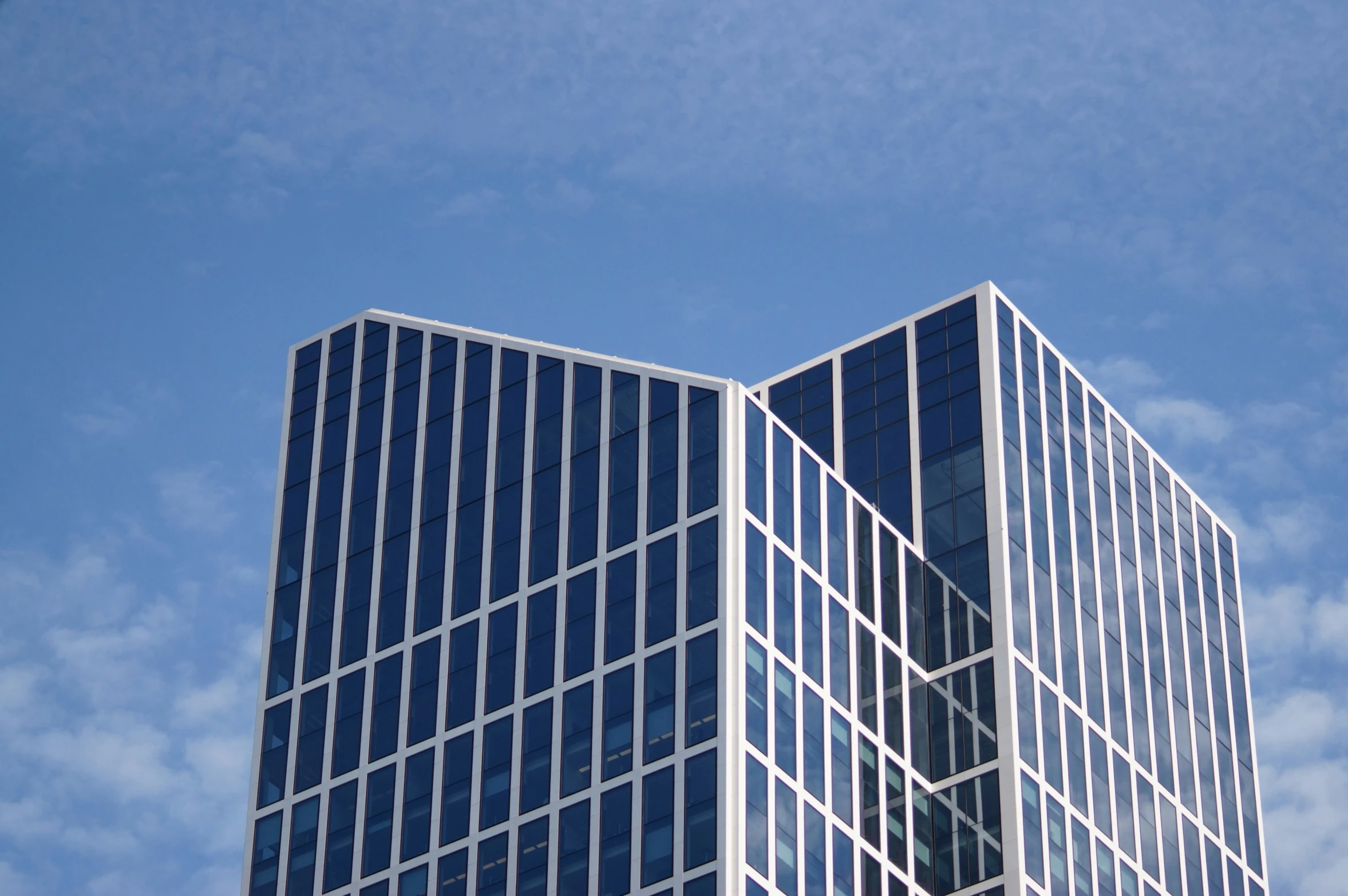 a very tall building that has glass windows