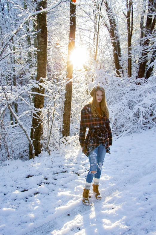 a person on snow shoes is walking in the snow