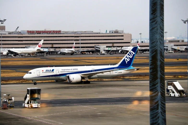 an airplane parked at a terminal next to a boarding ramp