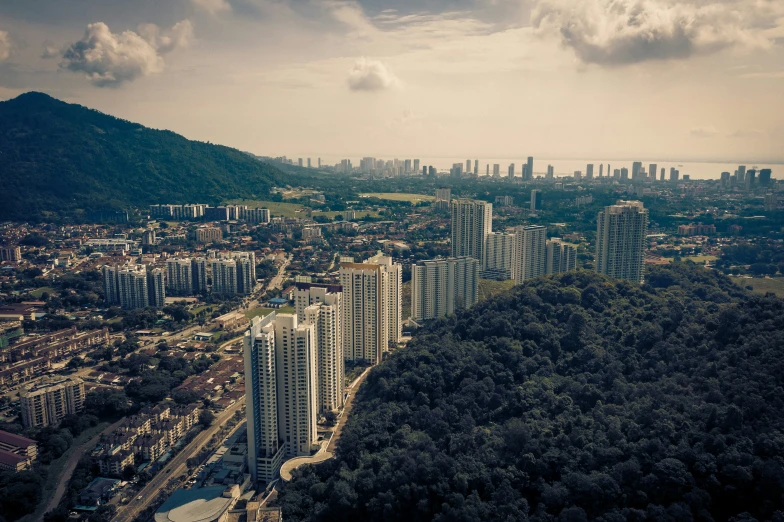 a picture of the city with mountains in the background