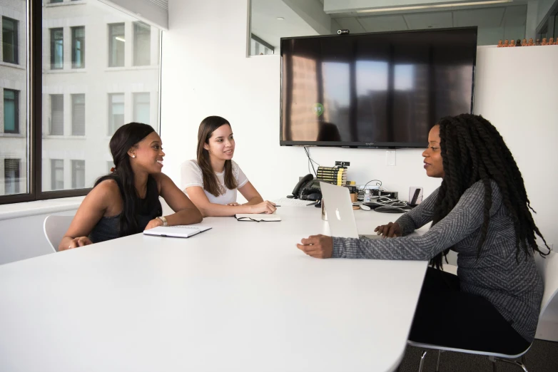 group of people gathered around a conference table