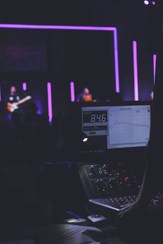 a po of someone's desk with a laptop and soundboard