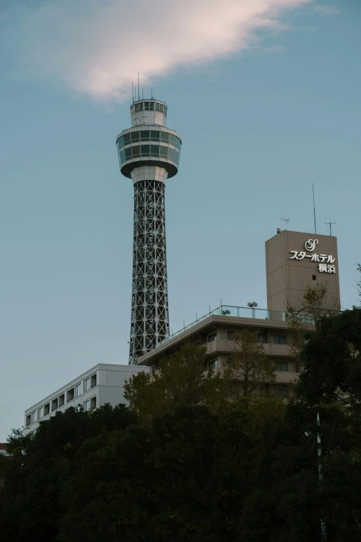 the tower is high and next to a building