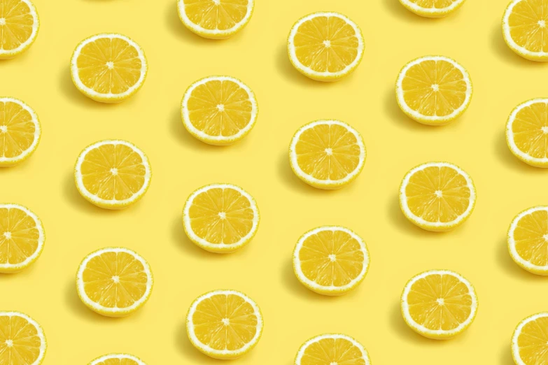 several slices of orange on a yellow background