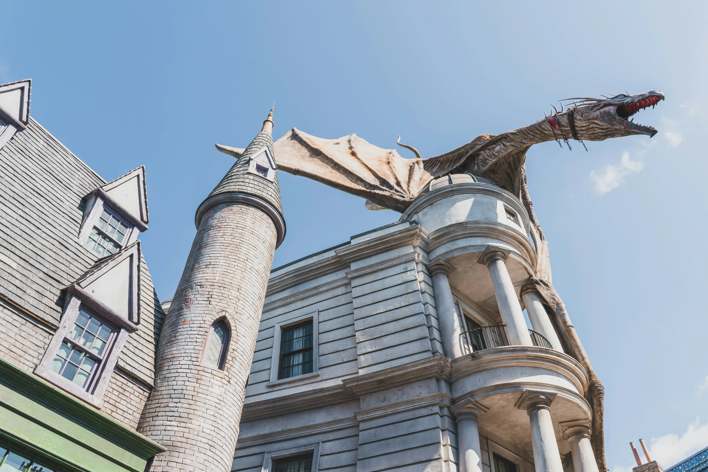 a building with a red dragon statue in front of it