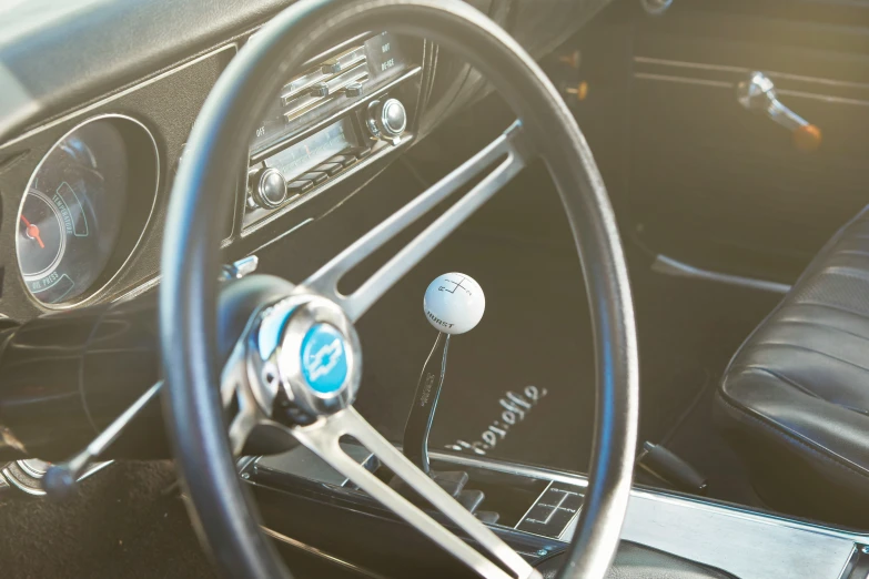 the dashboard and a golf ball in a sports car