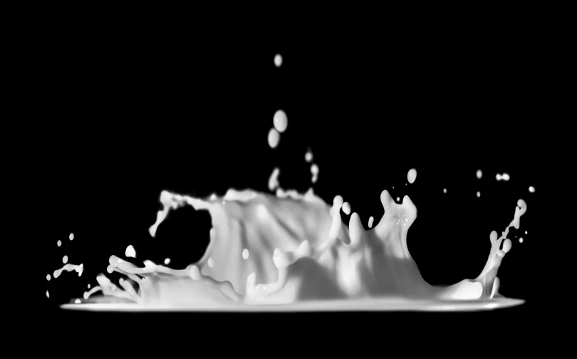 black and white pograph of milk splashing down the side of it